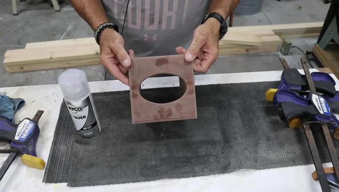 Apply finish: Apply a high-gloss lacquer finish.