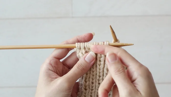 Continue working the remaining seven stitches in pattern until the piece measures 4 inches (10 cm).