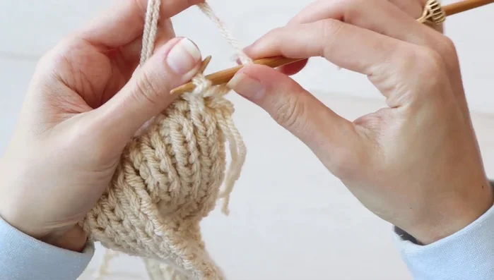 Continue working in pattern until the second piece measures 6.5 inches (17 cm).