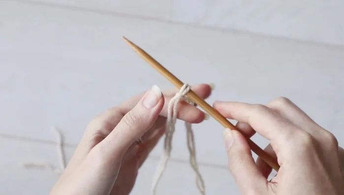 Work a 1x1 rib (knit one, purl one) until the piece measures 6.5 inches (17 cm).