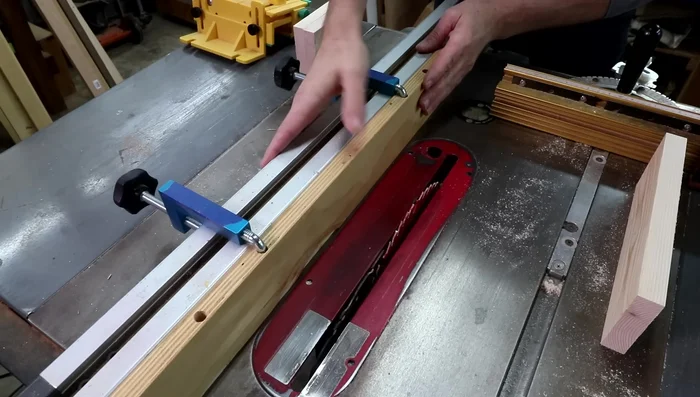 Lower the table saw blade to half the thickness of the board.