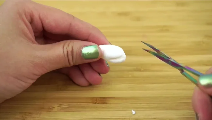 Create the petals: Make a teardrop shape with paper clay, cut it into five sections, and gently push the petals outwards. Flatten and thin the petal edges using a toothpick and rolling motion.