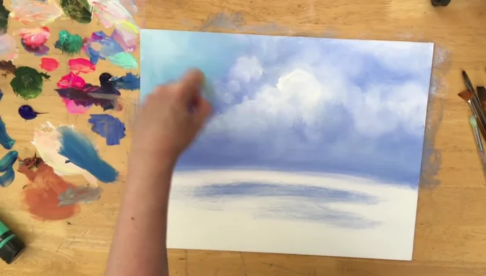 Add hints of sky blue to the clouds and horizon.