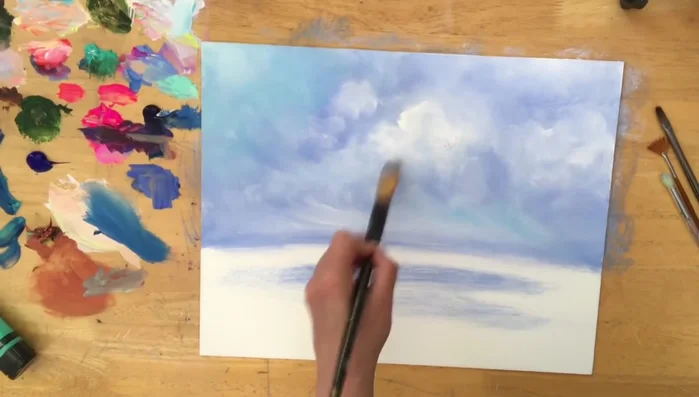 Add hints of sky blue to the clouds and horizon.