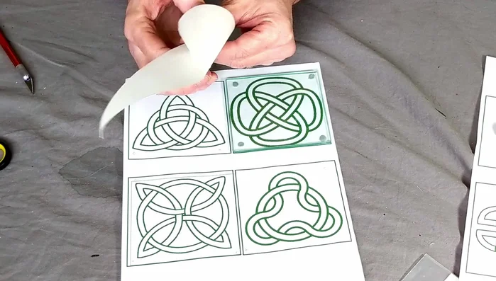 Outline the design: Use a gold paint outliner and a piping bag to outline your Celtic design. This creates a clean, defined edge.