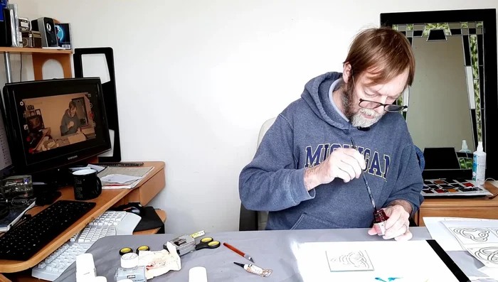 Flood fill the design: Apply red Pebeo paint to the main areas of your design using a flood-filling technique. Ensure you get the paint right up to the gold outline.