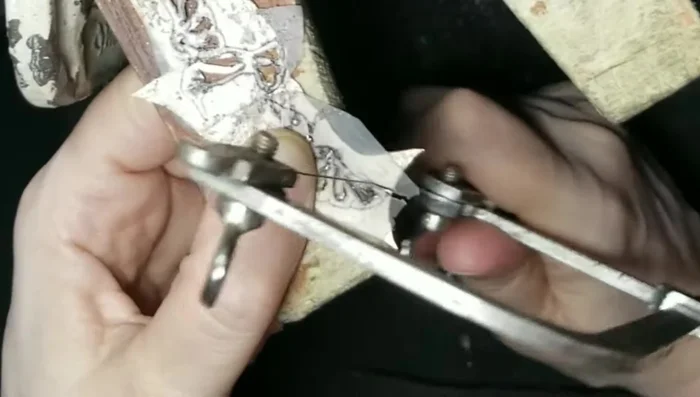 File the edges of the cut-out shapes, smoothing both the inner and outer contours.