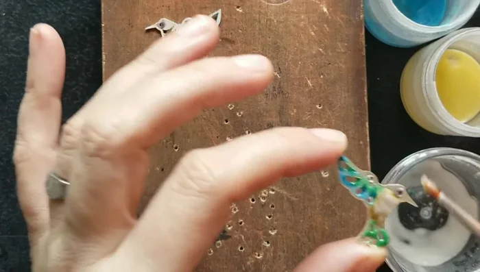 Fire the earrings again in the kiln.