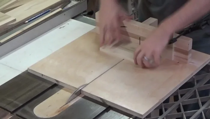 Cutting the sides, fronts, and backs of the box using a stop block on a crosscut sled.
