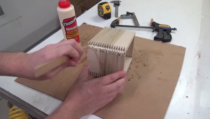 Gluing and clamping the finger joints.