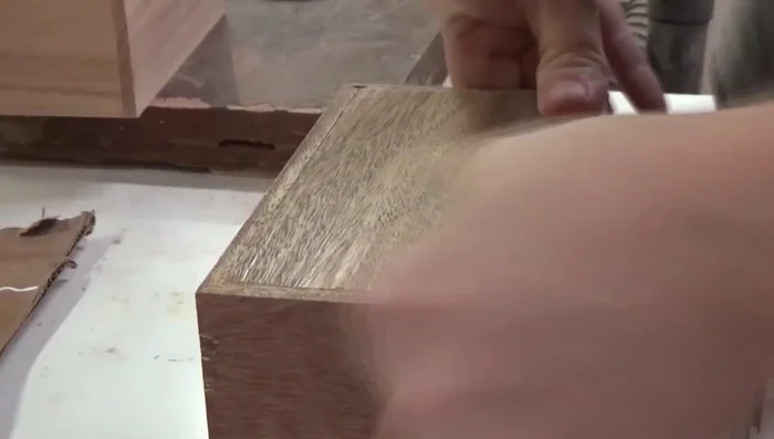 Inserting the tops and bottoms, cutting them in half, and sanding any imperfections.