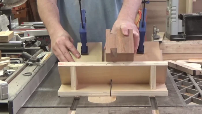 Adding a handle (Bird's Eye Maple and Purple Heart) and chamfering the bottom edge.