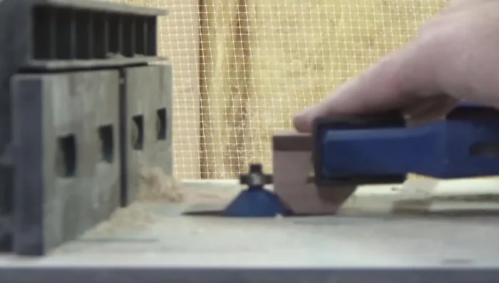 Adding a handle (Bird's Eye Maple and Purple Heart) and chamfering the bottom edge.