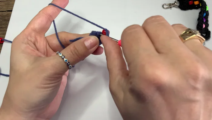 Continue adding beads and crocheting until you reach the desired length of your keychain.