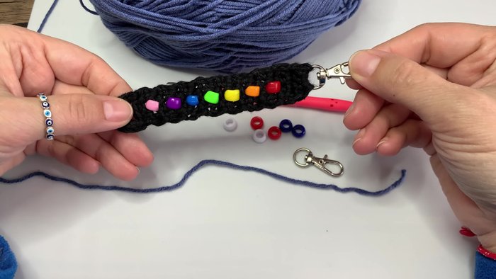 Gather your pony beads and yarn. Choose your desired colors and quantities.