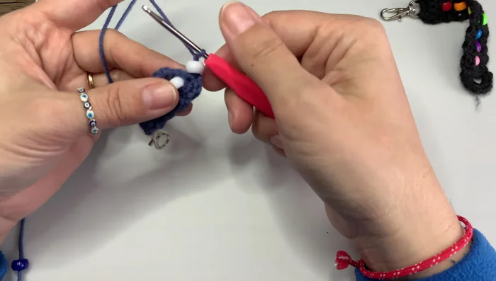 Continue adding beads and crocheting until you reach the desired length of your keychain.