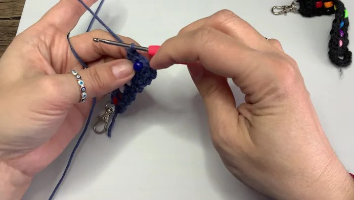 Weave in the loose ends to secure the keychain.