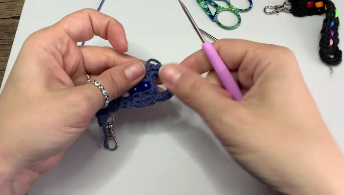 Weave in the loose ends to secure the keychain.