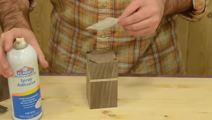 Drill holes according to your pattern (5/16 inch holes for pencils, a 1-inch hole for other items).