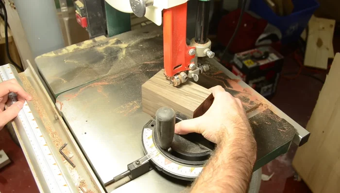 Glue the plywood square onto the angled top of the pencil holder, then sand it flush.
