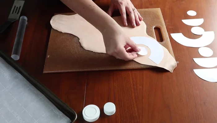 Cut out clay shapes using stencils.