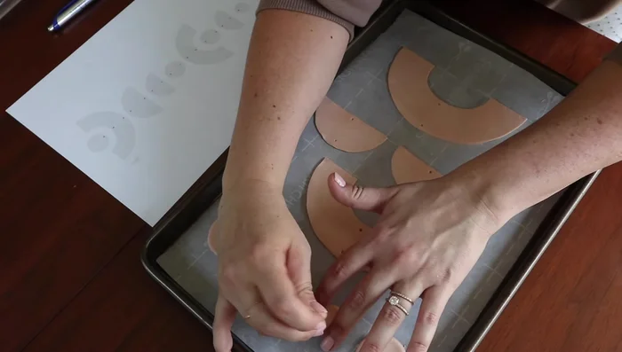 Use a needle to create holes for stringing.