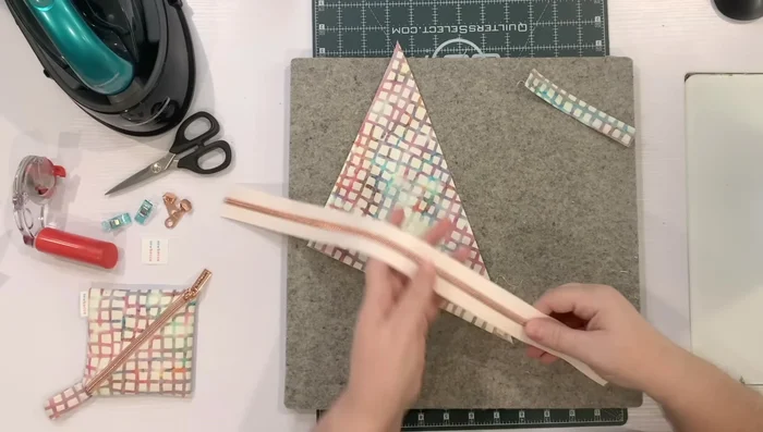 Prepare the zipper: Cut off metal stops if necessary, remove the zipper pull, and separate the zipper.