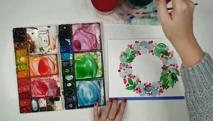 Adjust colors as needed, adding contrast and correcting any bleeding, using a clean, damp brush to lift excess paint.