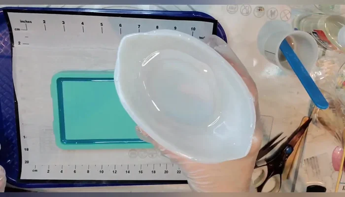 Pour the first layer of resin into the tray and spread evenly.