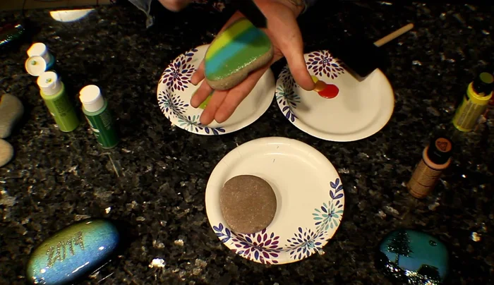 Apply the brush to the rock, using swiping motions to blend the colors. The more swipes, the better the blend.