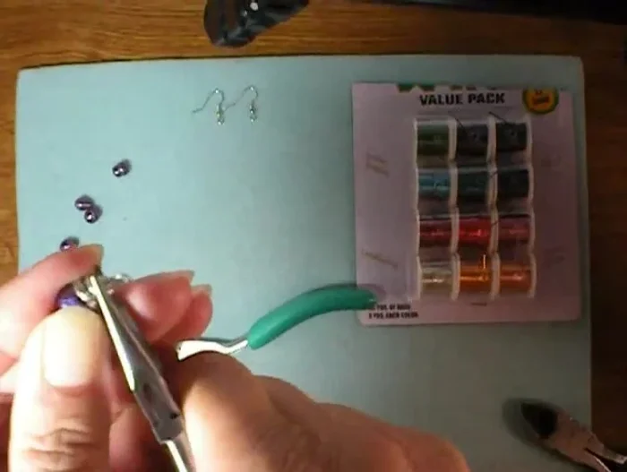 Tuck in the end of the wire and use pliers to adjust the loop as needed.