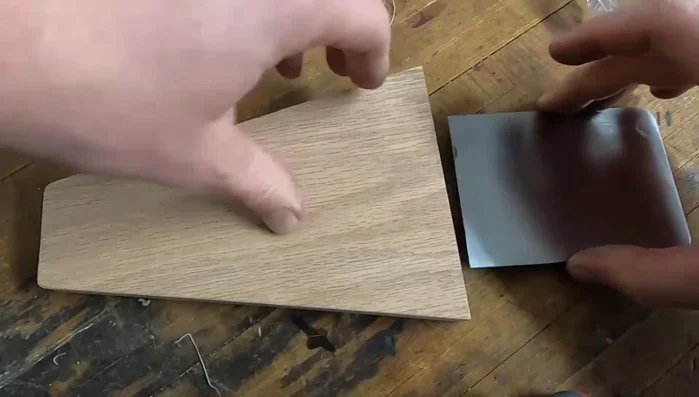 Apply wood glue and super glue to secure the metal foot to the wood.