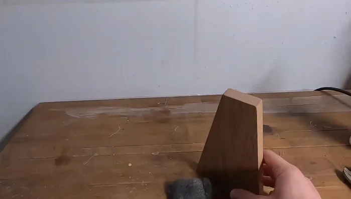 Assemble the bookend by inserting the metal foot into its slot and ensuring a tight fit with the glue.