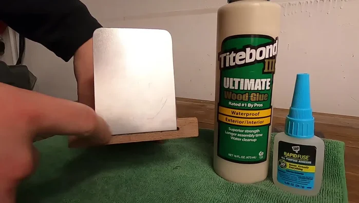 Apply wood glue and super glue to secure the metal foot to the wood.