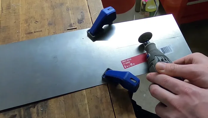 Polish the steel using Mother's polish and a buffing wheel.