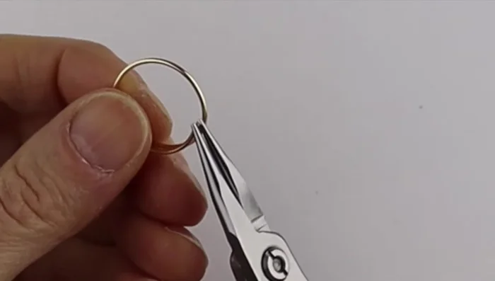 Clip the excess wire flush and flatten the loops to make them comfortable to wear.