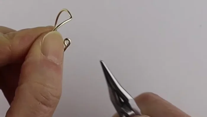 Clip the excess wire flush and flatten the loops to make them comfortable to wear.