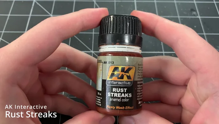 Soak an artist sponge in enamel thinner, and stipple it over the dark rust wash to break up the color and create texture.