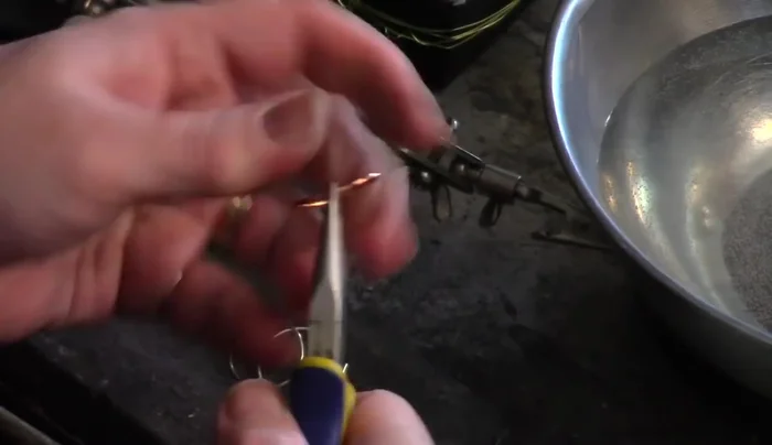 Join the wire ends: Using chain nose pliers or your fingers, carefully align the two ends of the wire, ensuring they meet perfectly without any gaps. This is crucial for a seamless solder joint.