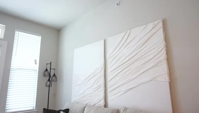 Hang the canvases: Use Command hooks, ensuring they are level and evenly spaced.