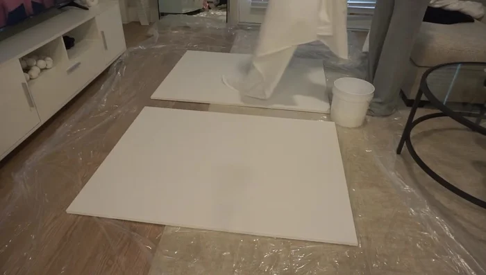 Apply more Mod Podge: Paint the remaining Mod Podge mixture onto the fabric to secure it to the canvas.