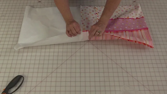 Press one seam open in one direction, the other seam in the opposite direction.