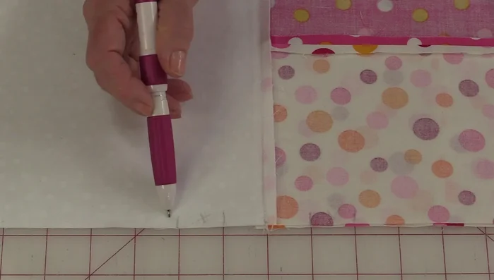 Stitch along the marked lines to create casings, leaving small openings on both sides for turning and inserting the drawstring.