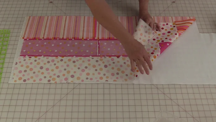 Place the two rectangles together, right sides facing. Sew along the edges to create a tube.