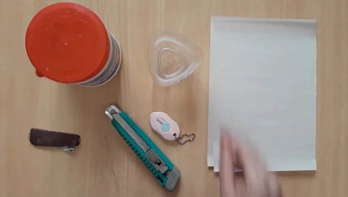 Applying paper mache to the entire mask for strength and smoothness.