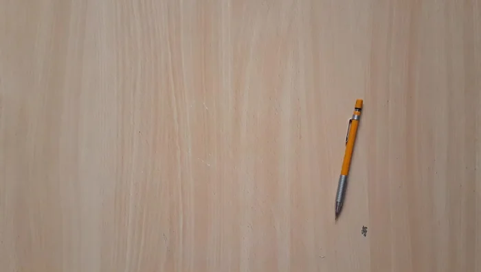 Cutting out the eye holes carefully after marking their positions.