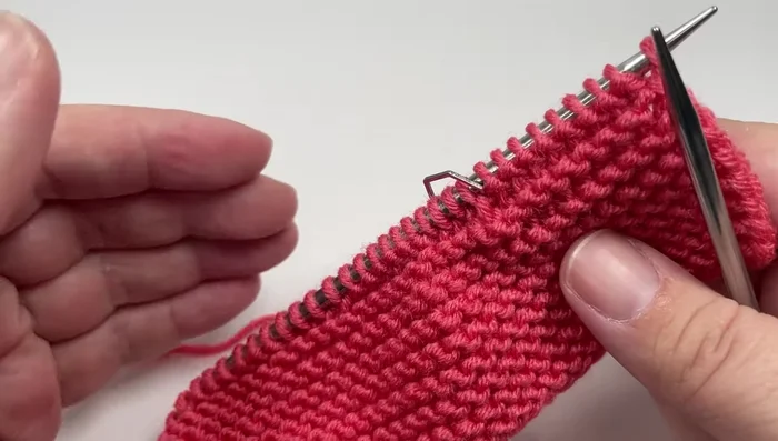 Row 4 (Wrong side): Knit nine stitches, slip marker, purl four stitches, *knit six, purl four; repeat from * to second marker, slip marker, knit eight, slip last stitch purlwise with yarn in front.