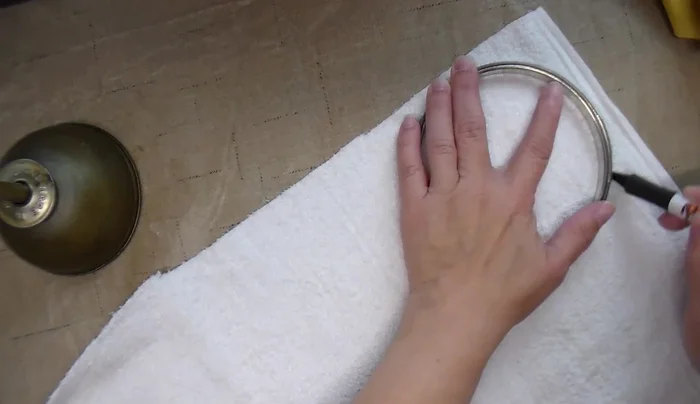 Cut double-layered cotton fabric circles using templates, centering terry cloth circles.