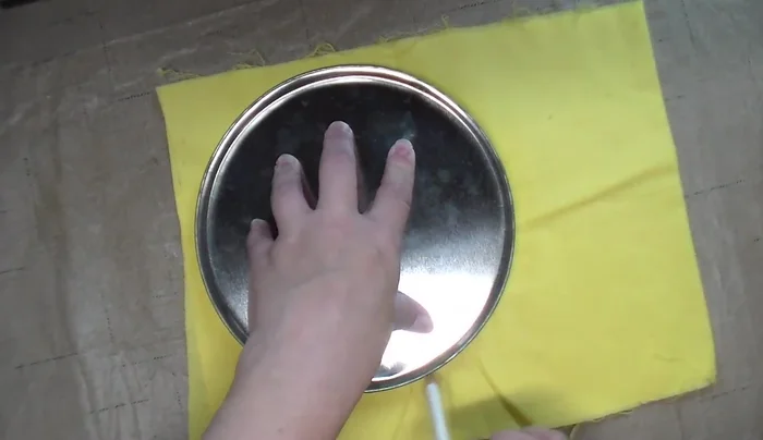 Cut double-layered cotton fabric circles using templates, centering terry cloth circles.