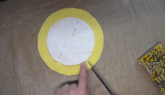 Cut petals into the fabric, keeping close to the terry cloth but not cutting it.